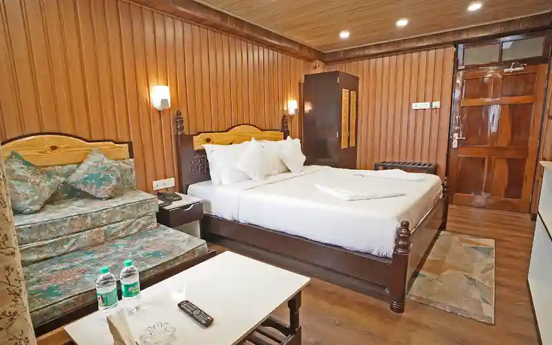 Sher Bengal Darjeeling Latest premium accommodation with comfortable bed and sofa area